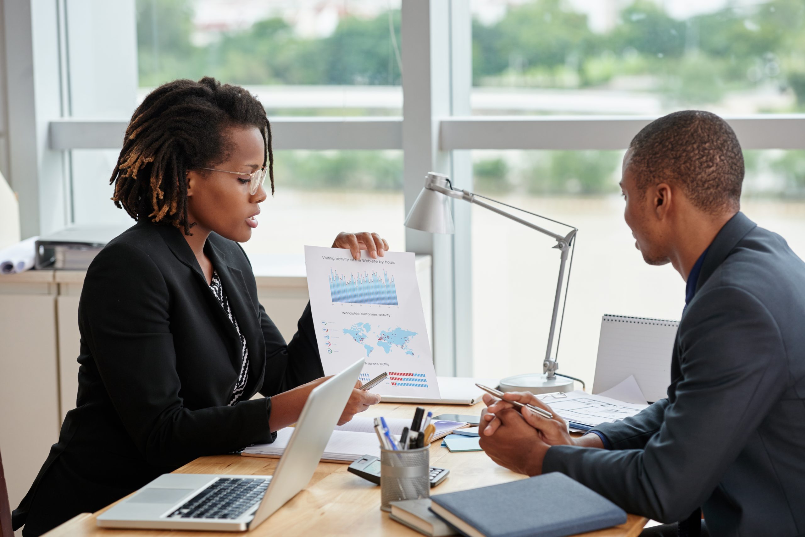 Black female Human Resource Consultant meeting with black client
